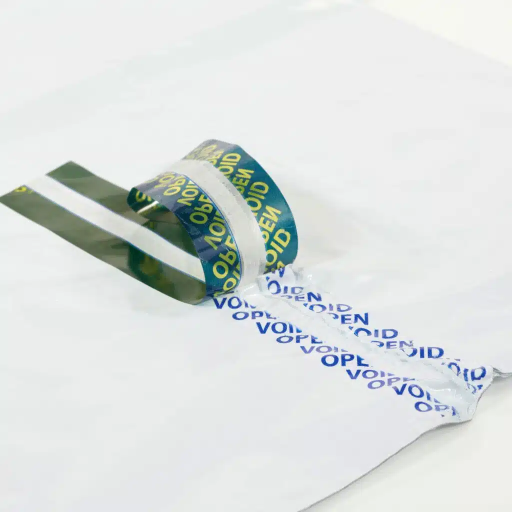 Tamper evident bag tape with 2 tone void