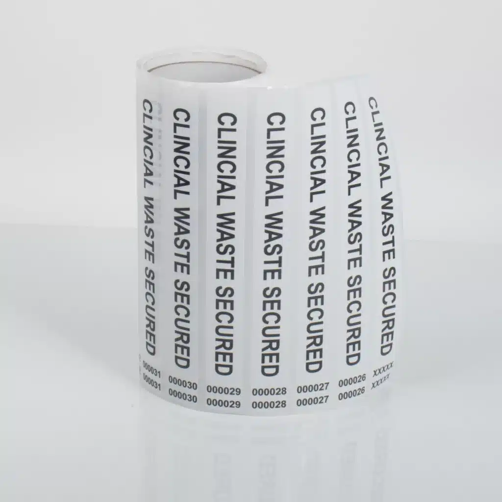 A roll of Clinical Waste secure tamper evident labels with sequential dual number tabs from Tampertech