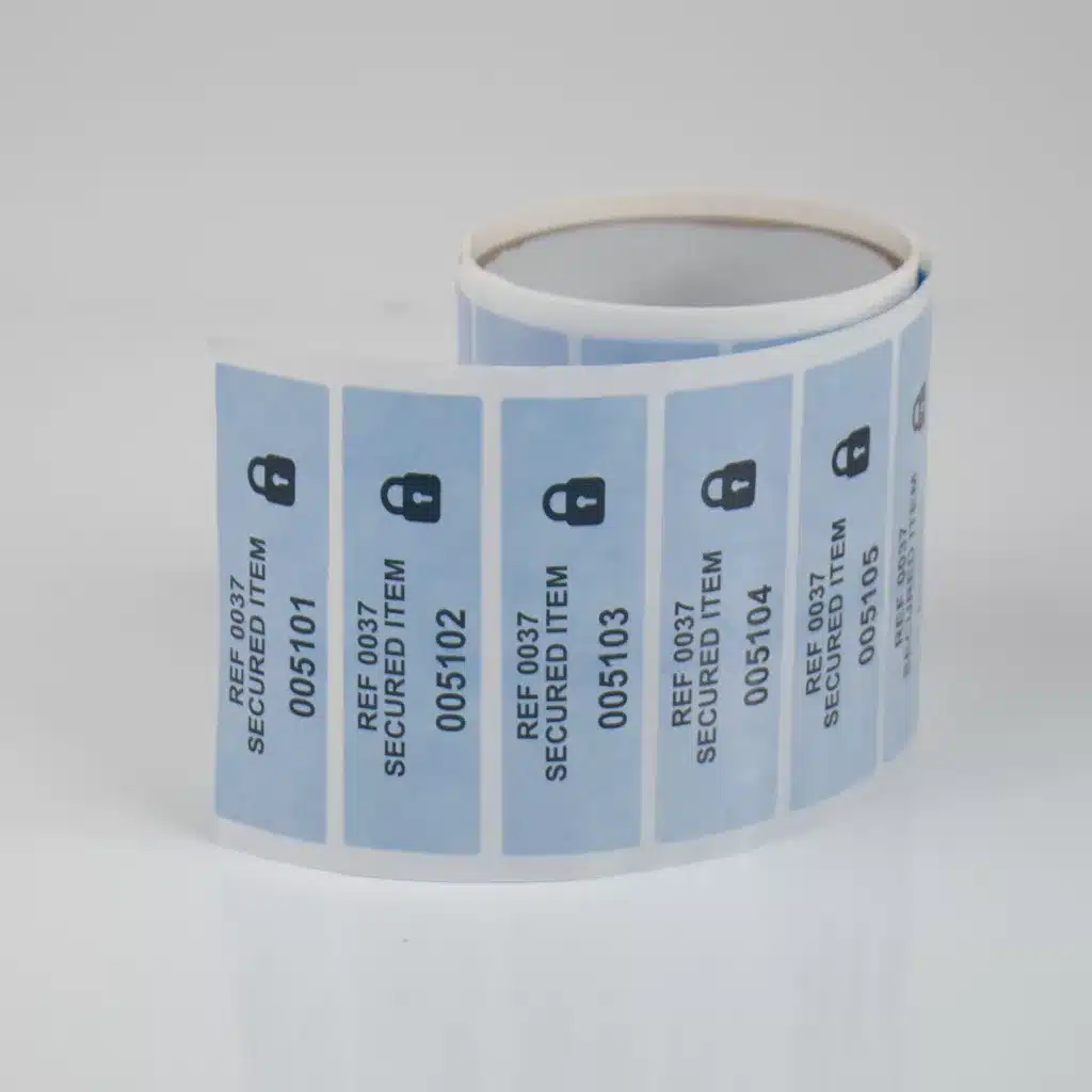 mage of a roll of blue 100% paper tamper evident reusable Pouch Secure labels with consecutive numbers, 85mm x 25mm, 1000 per roll.