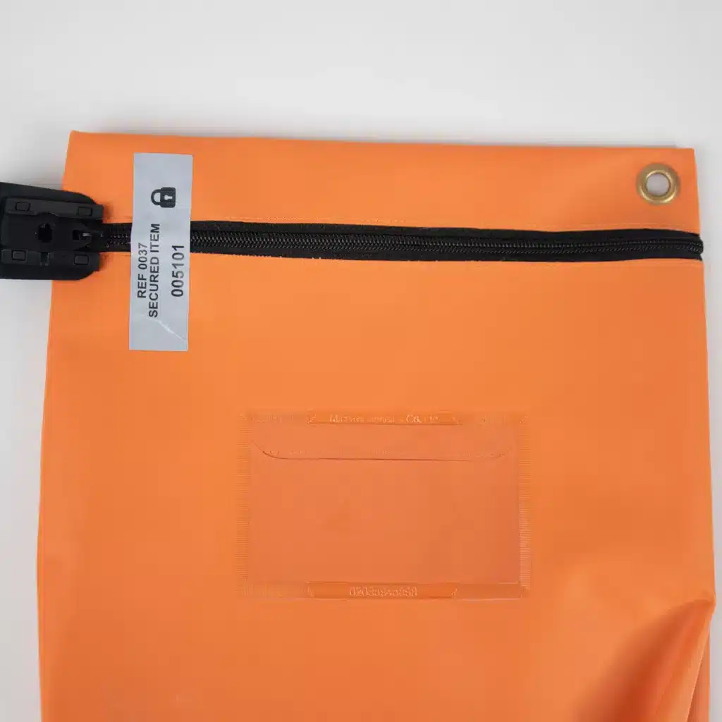 Image of a paper tamper evident reusable Pouch Secure label attached to a pouch over the zip.
