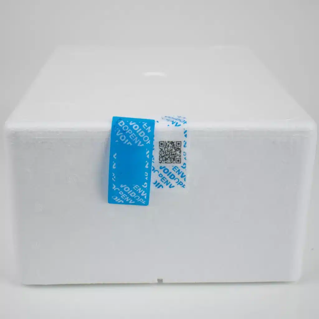 Image of blue Tampertech Cold Chain Secure Labels applied and removed, showing the void message on the surface with the QR code and in the label film when removed.