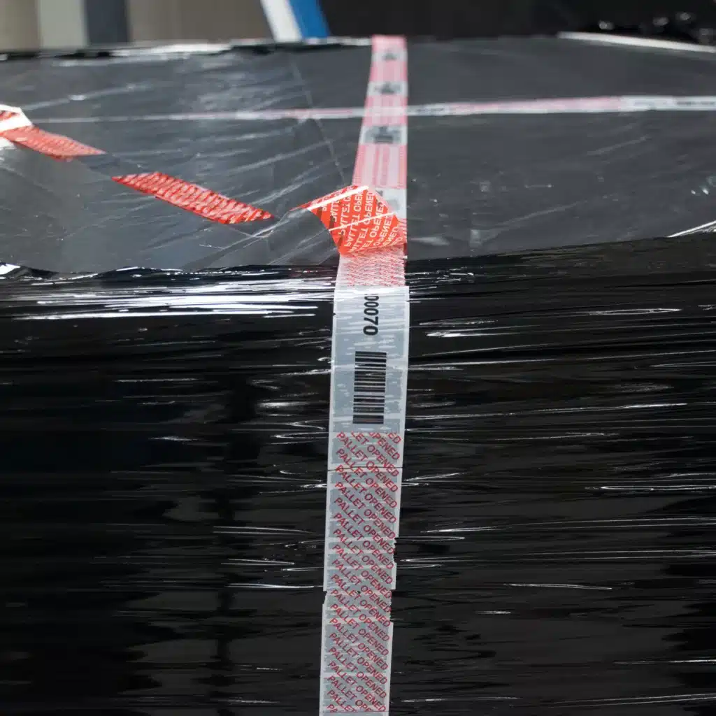 Close up image of Tampertech Pallet Secure Tamper Evident Security Tape voided, demonstrating the same number and barcode are still visible.