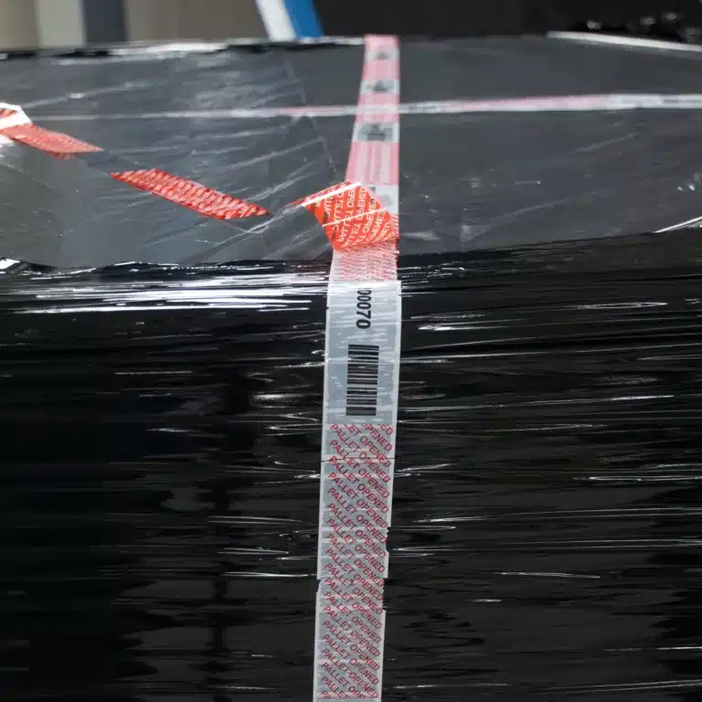 Pallet Security Tamper Evident Tape cold chain supply chain Close up image of Tampertech Pallet Secure Tamper Evident Security Tape voided, demonstrating the same number and barcode are still visible.