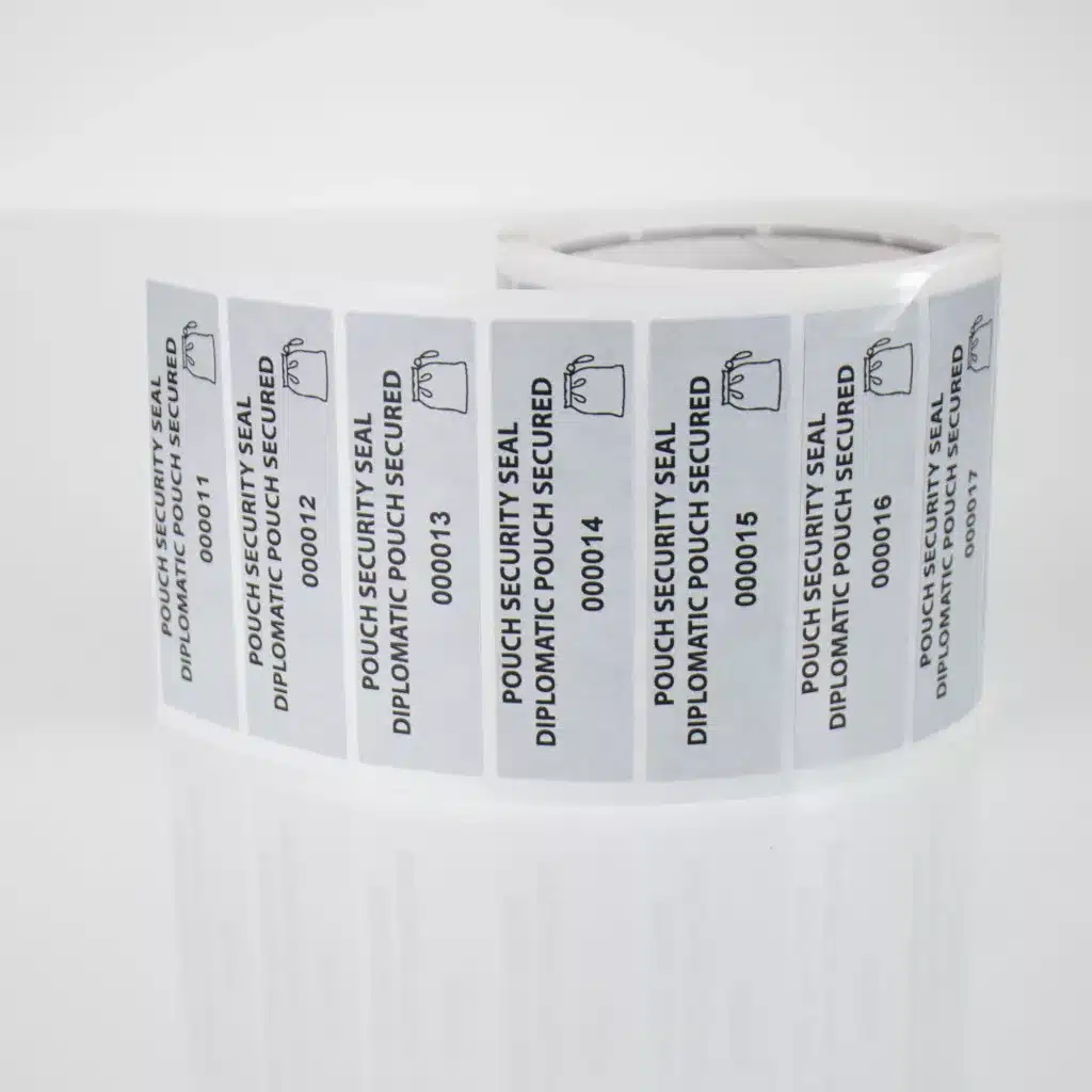 Roll of white non-residue pouch secure labels, 85mm x 25mm with sequential numbers, 1000 labels per roll.
