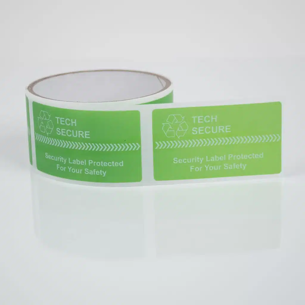 Roll of Tampertech green permanent Tech Secure labels, 70mm x 40mm with security cuts, 500 labels per roll.