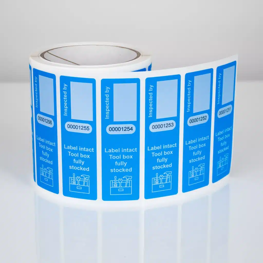 Roll of blue non-residue pouch secure labels, 100mm x 30mm with signature panel, sequential numbers, and security cuts, 1000 labels per roll manufactured by Tampertech