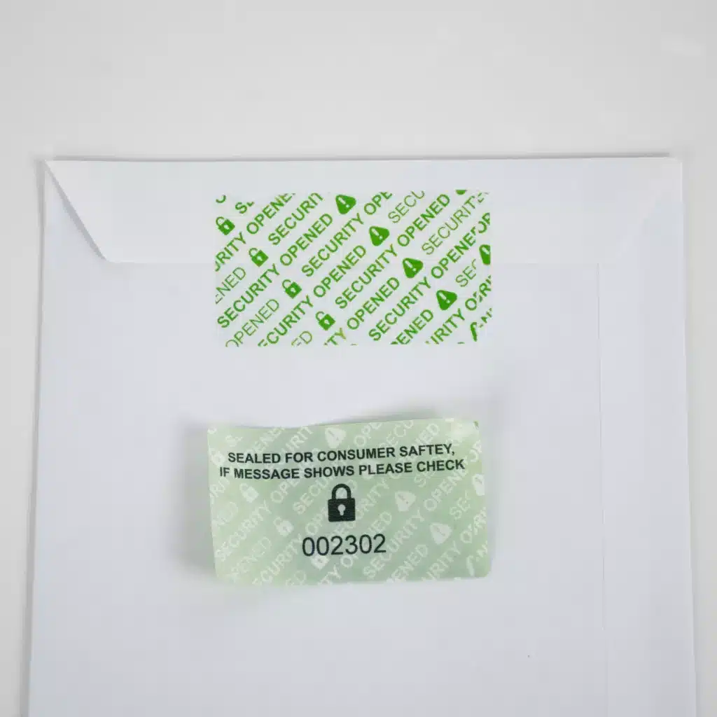 paper permanent label Removed Secure Item Permanent Green Tamper-Evident Label on Envelope - 'SECURITY OPENED' Void Message with a unique identifier sequential number